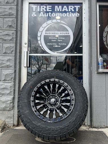 FUEL Wheel in front of The Tire Mart shop door